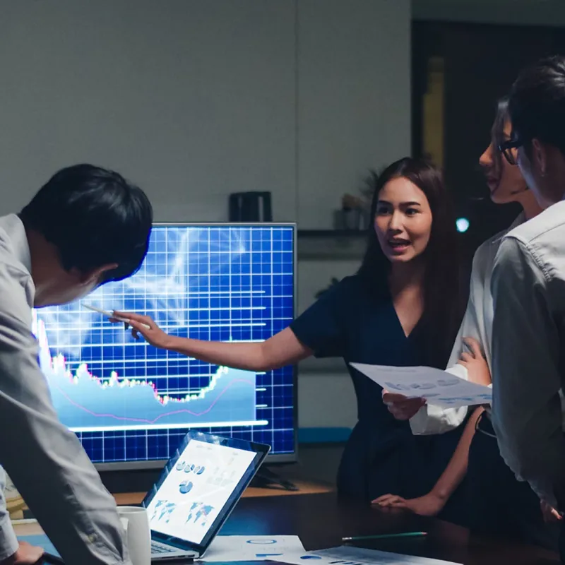 Team reviewing business charts in a meeting